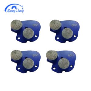 Double trapezoidal grinding head with diamond tips for concrete grinding